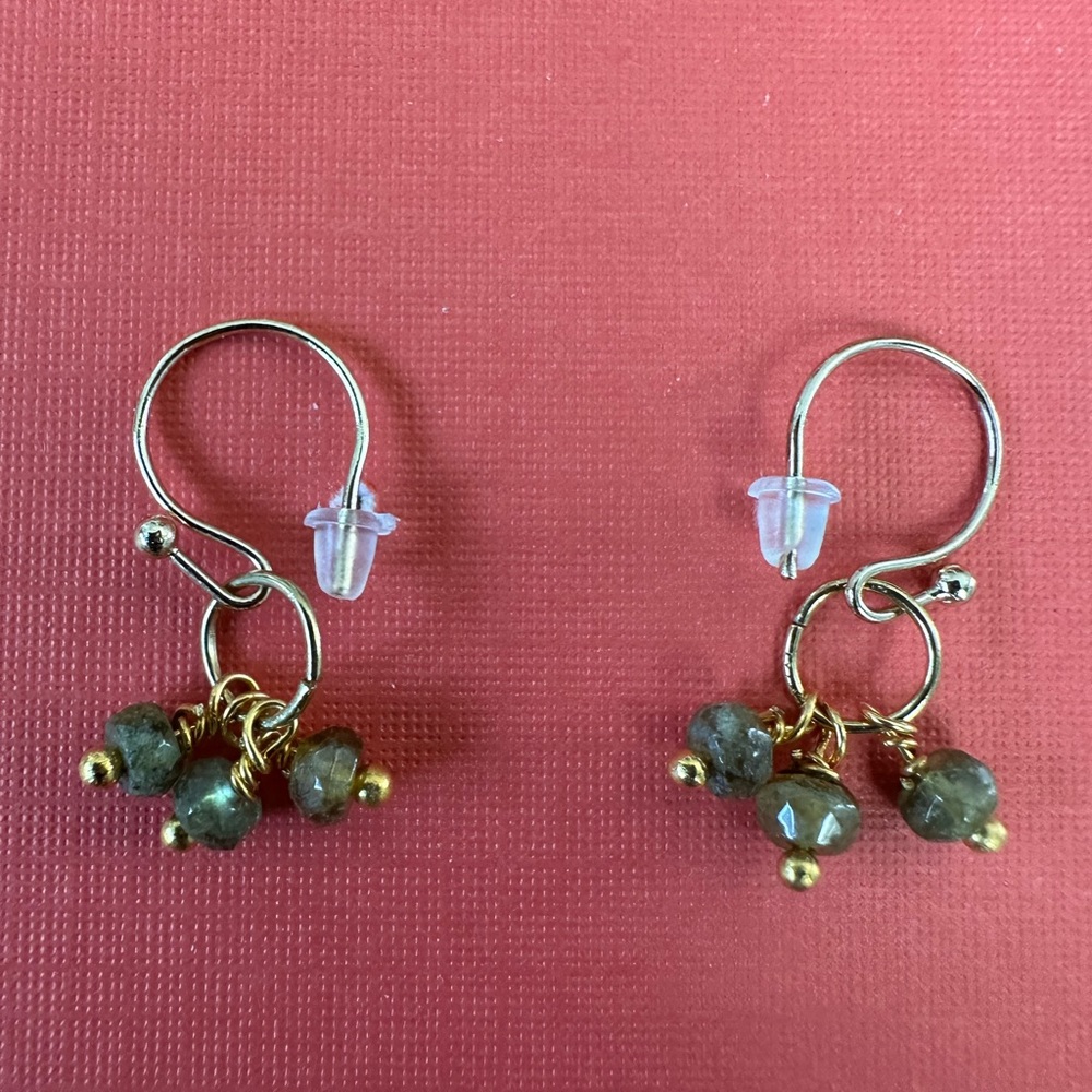 Homemade earrings, gold colored wire, green garnets